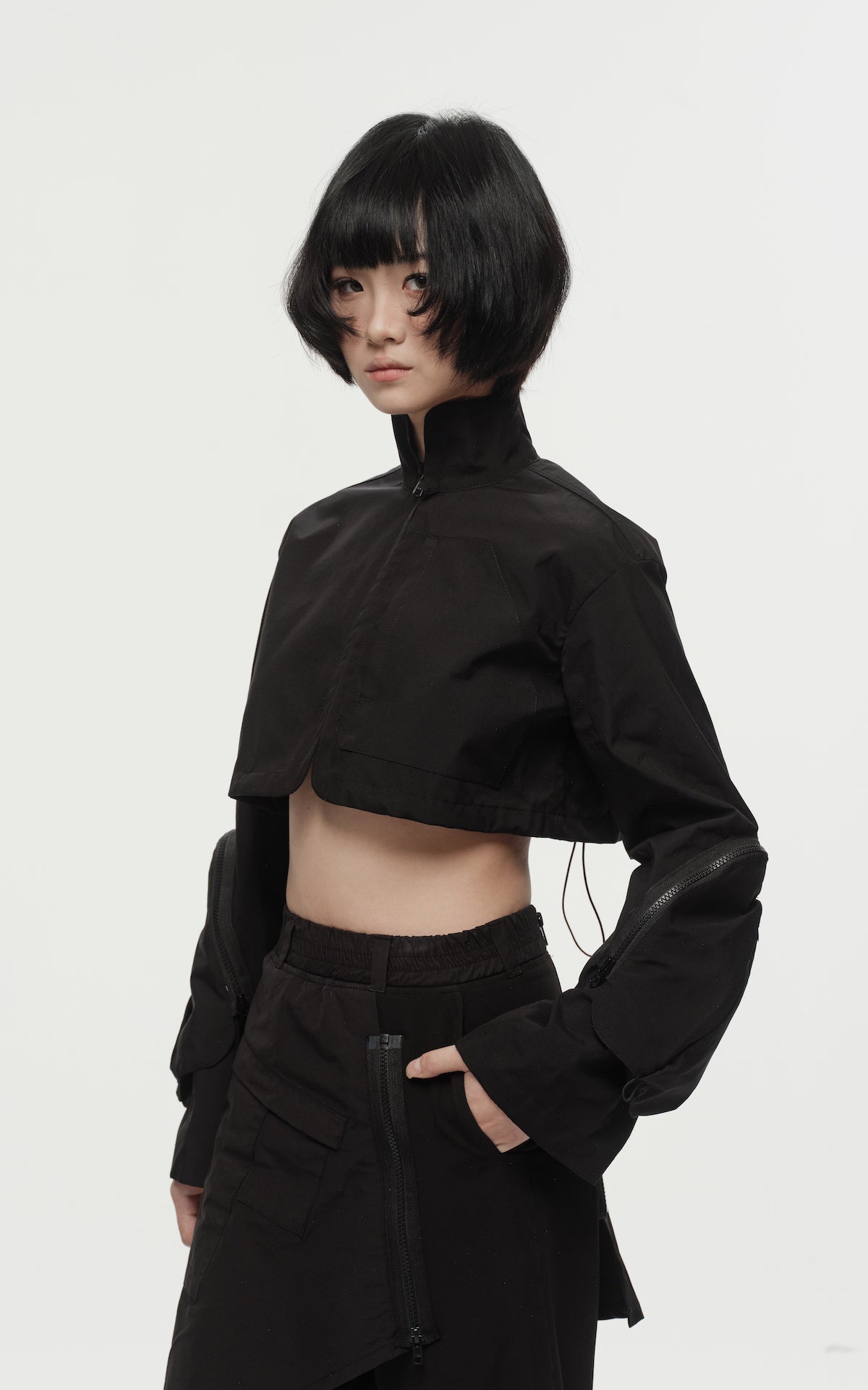 1. "REI" 3L Waterproof Cropped Jacket with Removable Bag / TRJCT W