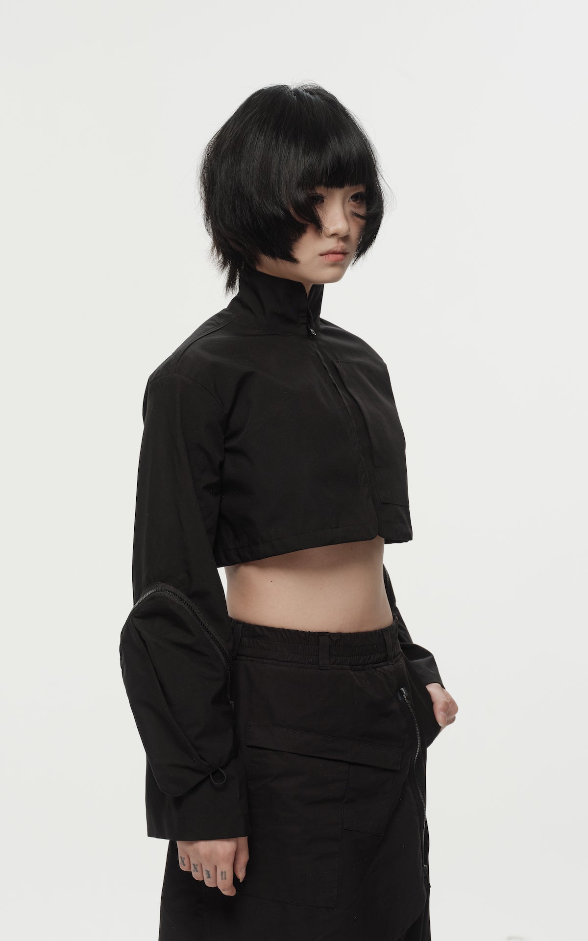 1. "REI" 3L Waterproof Cropped Jacket with Removable Bag / TRJCT W