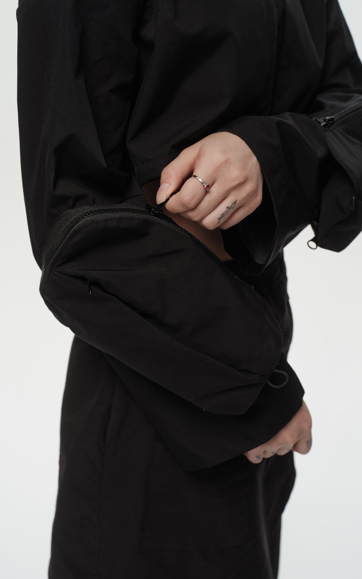 1. "REI" 3L Waterproof Cropped Jacket with Removable Bag / TRJCT W